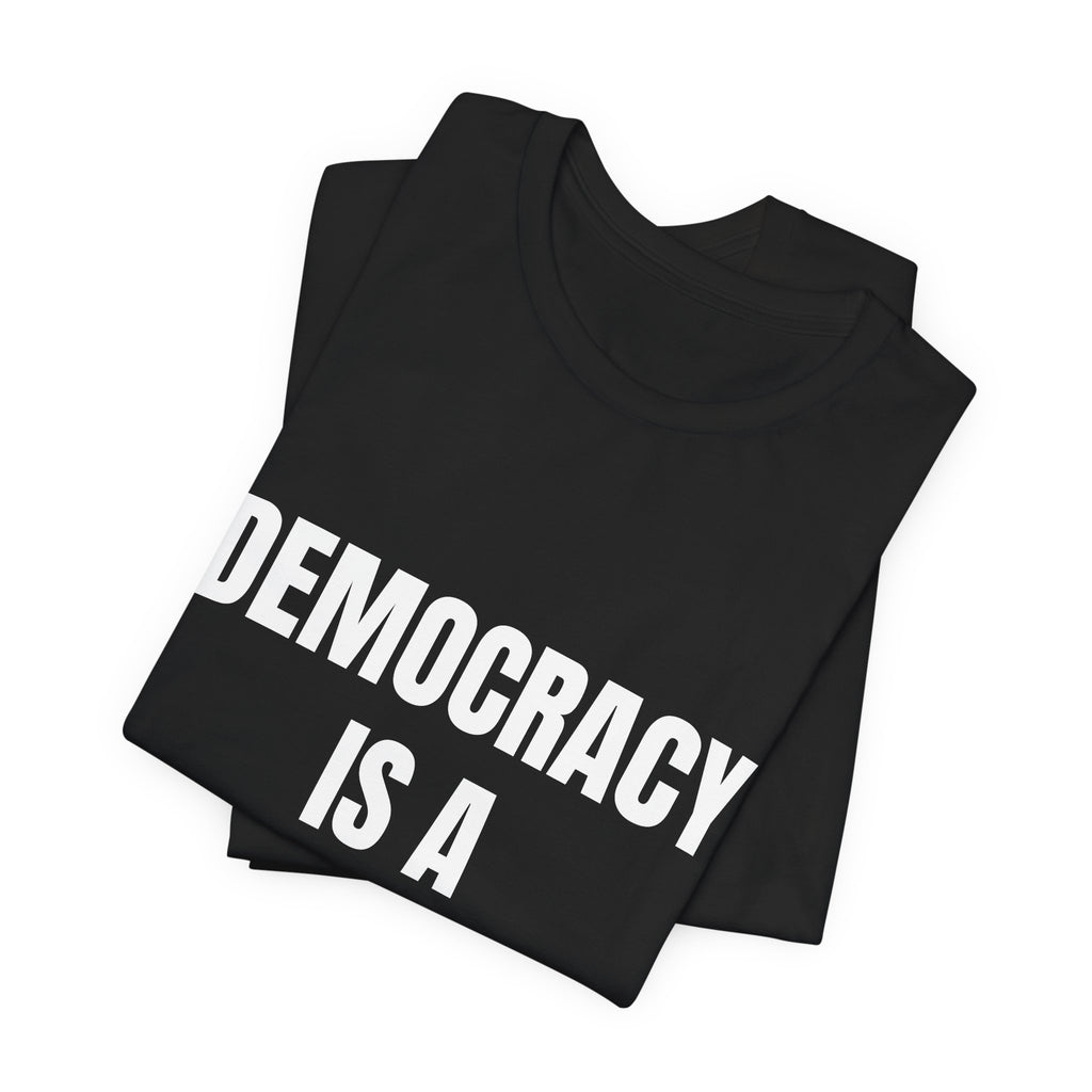 Activist t-shirt printed with “Democracy Is a Verb” by The People's Report HQ
