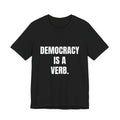 Democracy Is a Verb t-shirt in black, navy and dark grey heather, white block lettering